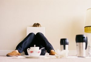 Girl working on her laptop with a few drinks surrounding her