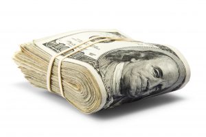 Large one-hundred dollar bills held together by a rubber band.