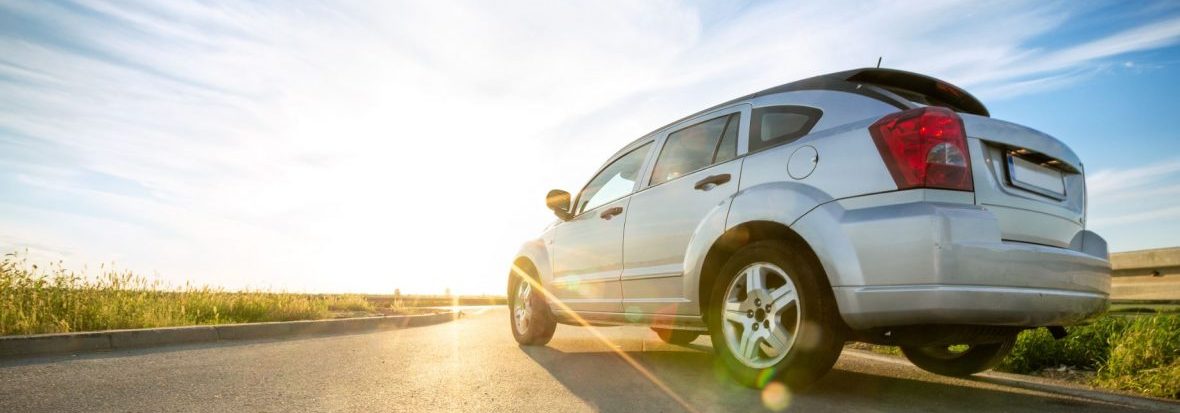 A car drives on the open road. Max Cash Title Loans brokers loans all across the state of Texas.